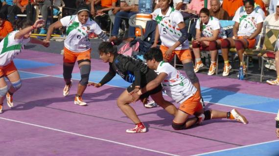 Pinky Roy (Defender) in action perfroming Back Hold on Himachal Pradesh raider during Senior National 2020 representing Indian Railways in the final battle.